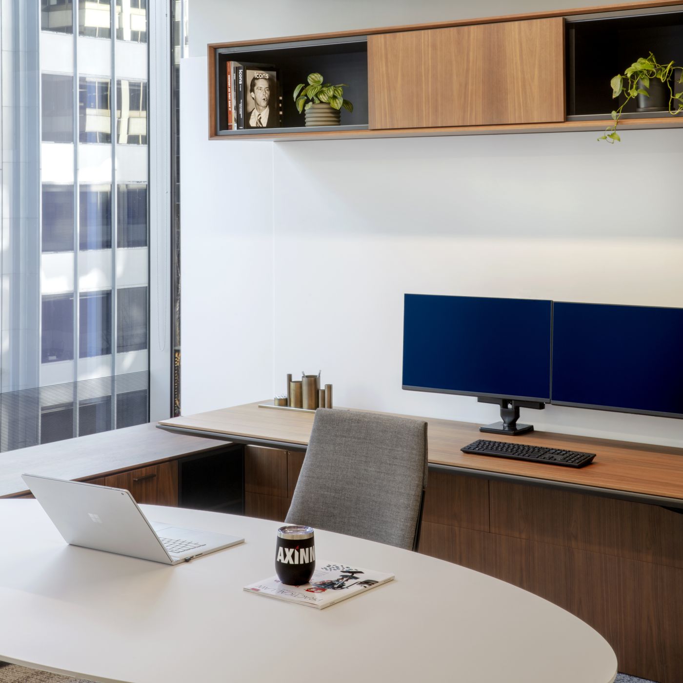 Private HALO OFFICE with adjustable-height work surface in American walnut and deep bronze.